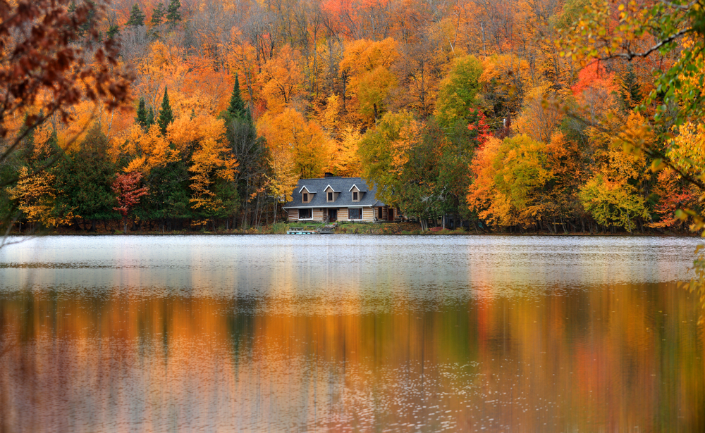 Canadian autumn landscape with vibrant fall colors, representing Canada's harvest-focused Thanksgiving